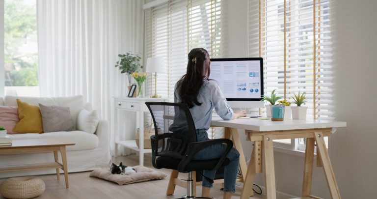 Woman working on her computer at a desk